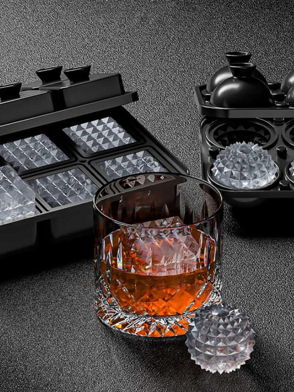 Guy sitting at a table full of different burgers and fries, laughing with a care